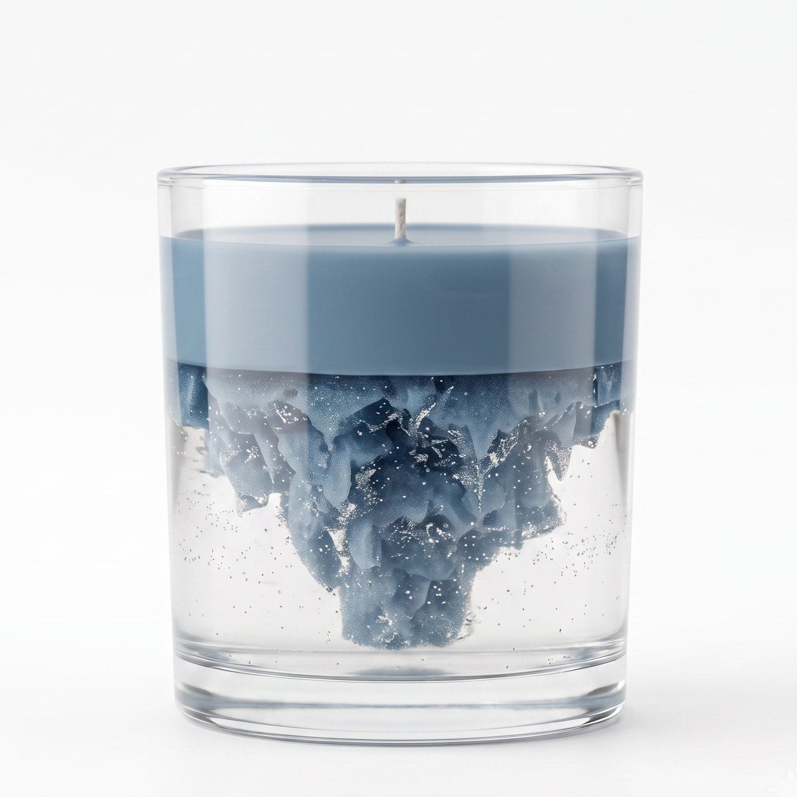 An artistic dual-layer iceberg soy and gel wax candle in a clear glass jar. Features a smooth solid colored top layer with an inverted 3D icicle mountain structure suspended in clear glittery gel wax on a white background.