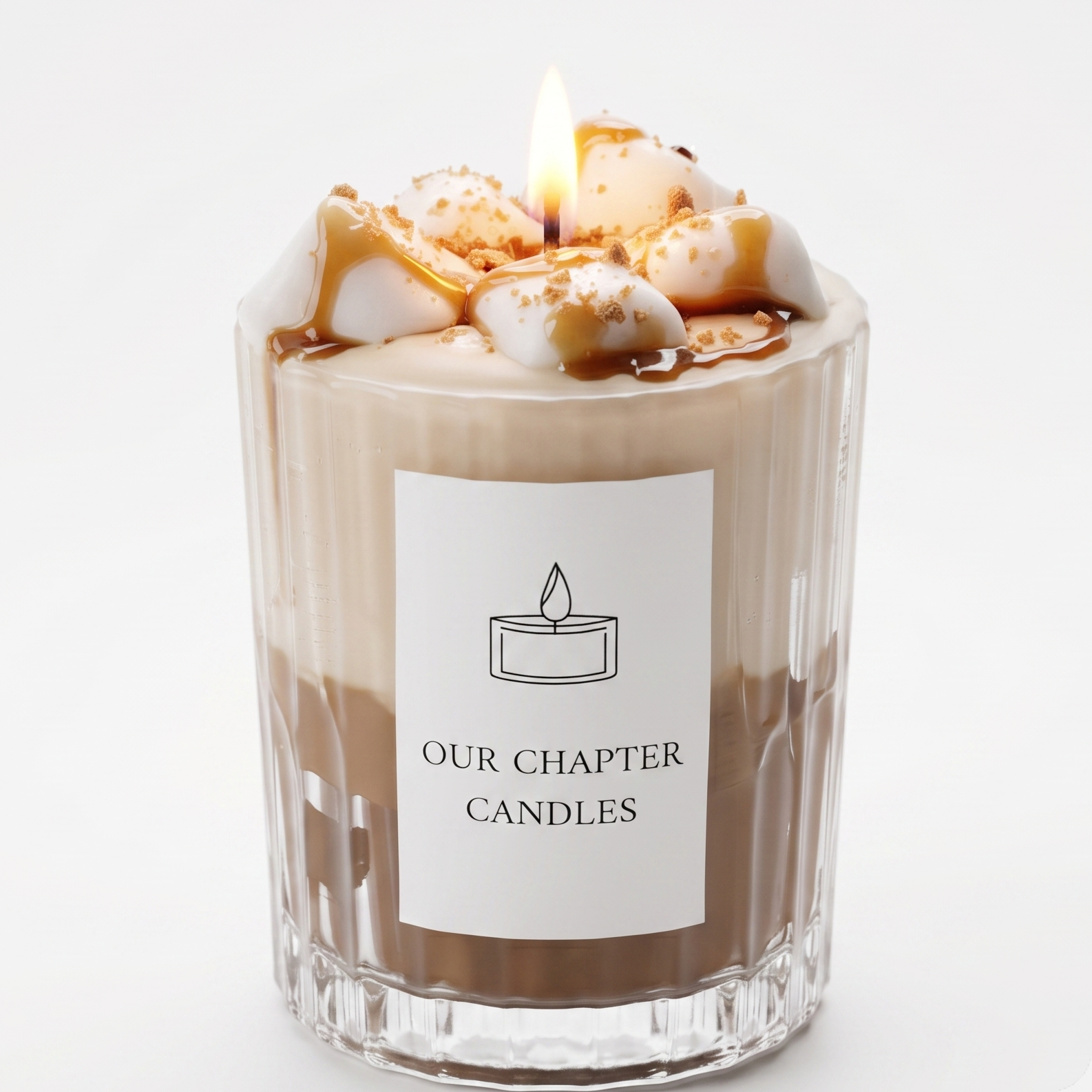 A luxury multi-layered coffee dessert soy wax candle in a clear ribbed glass jar based on image_ed063d.jpg. Features a brown coffee and cream white base topped with realistic wax marshmallows, glossy amber caramel drizzle, and a burning flame on a white background.