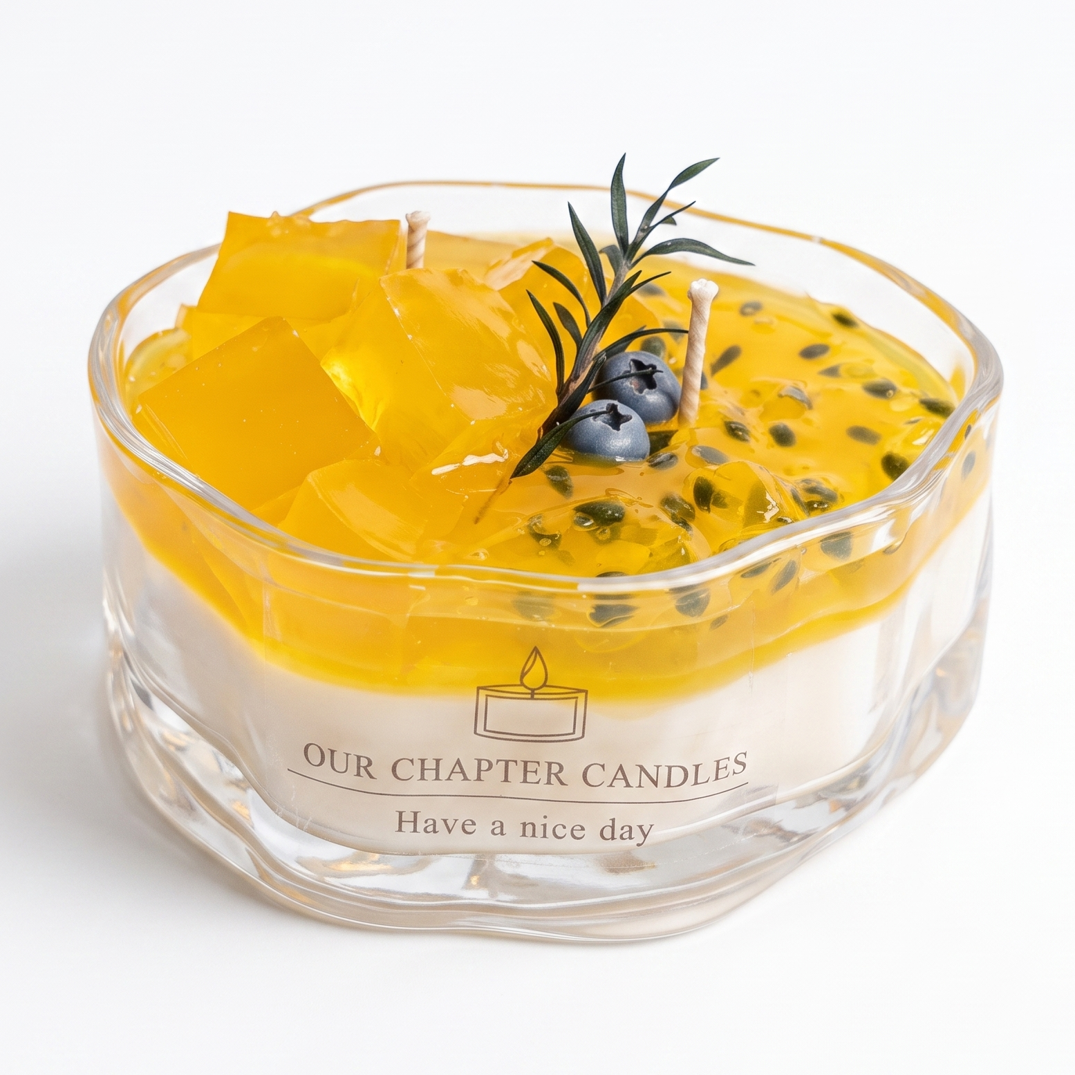 A luxury multi-textured passion fruit dessert soy and gel wax candle in an irregular wavy clear glass bowl based on image_4725bc.jpg. Features a solid white base, a vibrant golden-yellow gel layer topped with realistic wax jelly cubes, black passion fruit seeds, blue berries, and a green plant sprig on a white background.