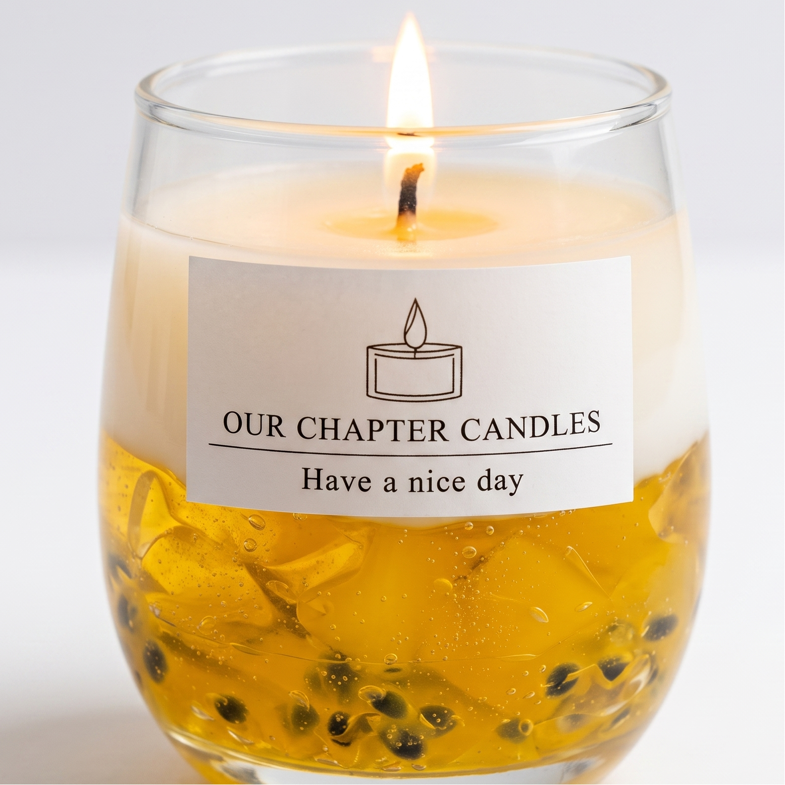 A luxury egg-shaped jar candle featuring a smooth milky-white soy wax top layer and a translucent golden-yellow gel wax bottom layer filled with realistic embedded passion fruit seeds and air bubbles, based on image_4554a4.jpg with a burning flame on a white background.