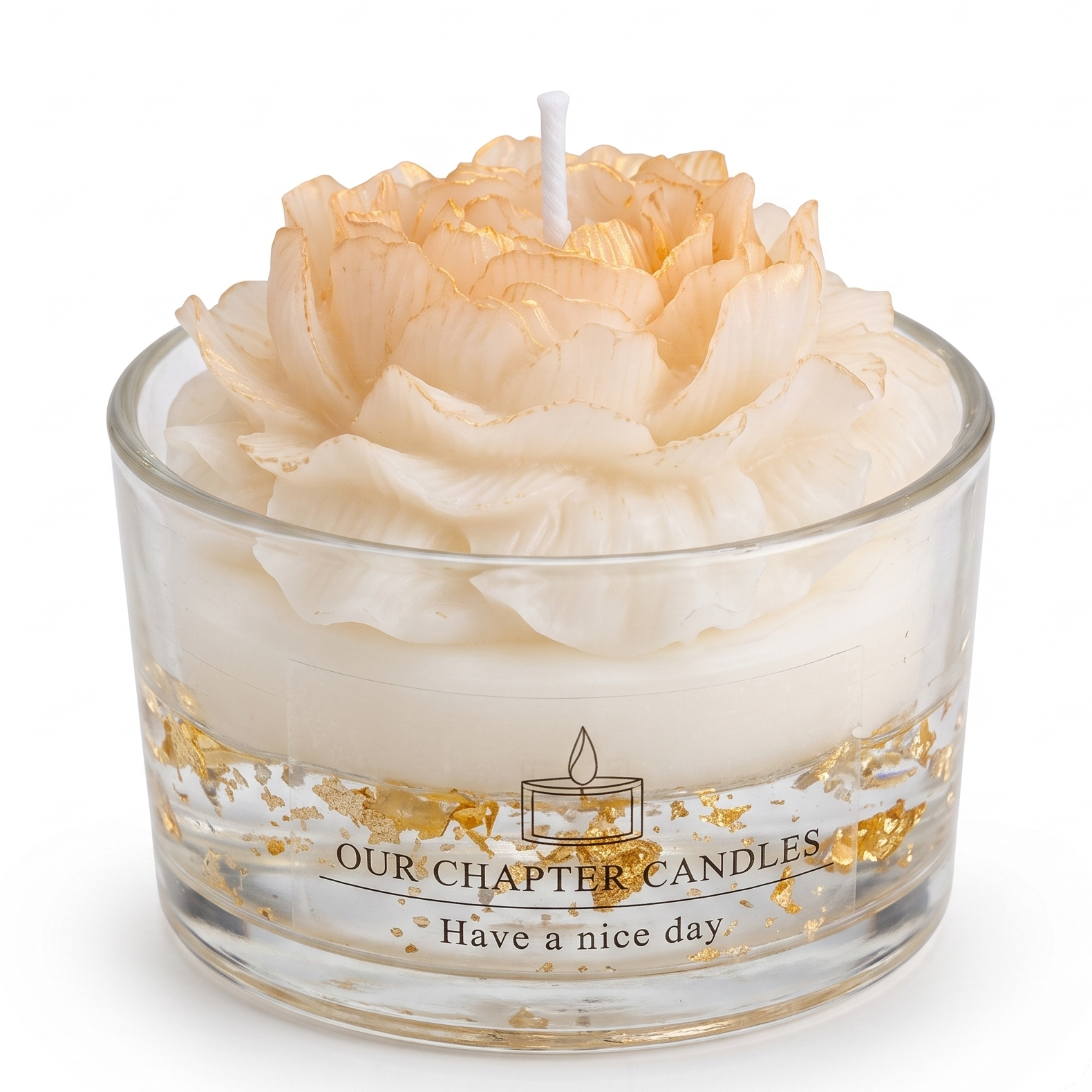 Peony flower shaped luxury soy wax candle in clear glass jar with 24k gold flakes. Transparent base features gold foil text reading "OUR CHAPTER CANDLES - Have a nice day". Premium hand-poured floral scented candle on a pure white background.